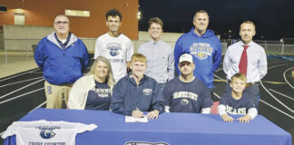 
			
				                                Present for the November 8 signing ceremony at MHS were: Front row, from left, Melissa Darnell (mother), Connor Darnell, Joey Darnell (father) and Cohen Darnell (brother); Back row, from left,Tim Davis (MHS Principal), Dean Freitag (SSU XC Assistant Coach), Conner Flynn (SSU XC Head Coach), Sean Inman (MHS XC Coach) and Aaron Lockhart (MHS Athletic Director). (Photo by Mark Carpenter)
 
			
		