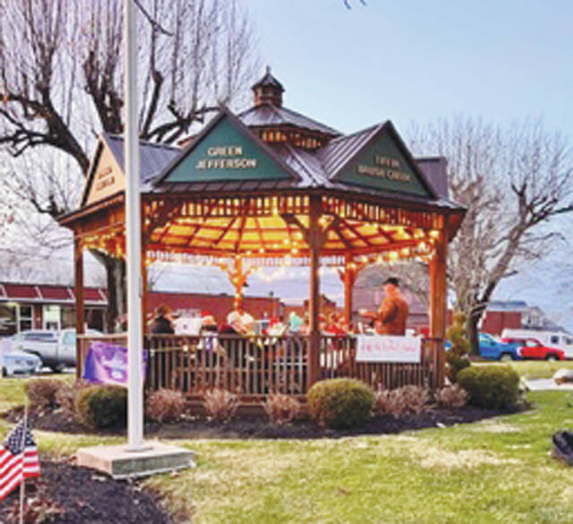 The Liberty Cornet Band playing Christmas tunes in the CourthouseSquare Gazebo. (Photo by Sherry Larson)
