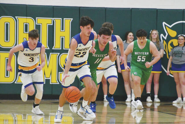 130290120_web1_DrewKennedy
Leading the Manchester cavalry up the court is senior Drew Kennedy (22), who tallied 10 points as the Greyhounds rallied late to secure a 47-41 win over Western Latham at the January 13 Coach Young Classic. (Photo by Mark Carpenter)