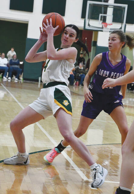 North Adams Karlie Kennedy gets the handle on the ball in action from the Lady Devils Saturday win over Chesapeake; Kennedy hit a pair of three-pointers in the first quarter to spark the North Adams offense. (Photo by Mark Carpenter)