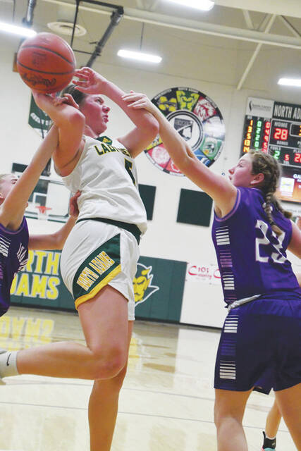 North Adams Katelynn Boerger draws a foul on this move to the basket in the Lady Devils win over Chesapeake at the 2024 Coach Young Classic. (Photo by Mark Carpenter)
