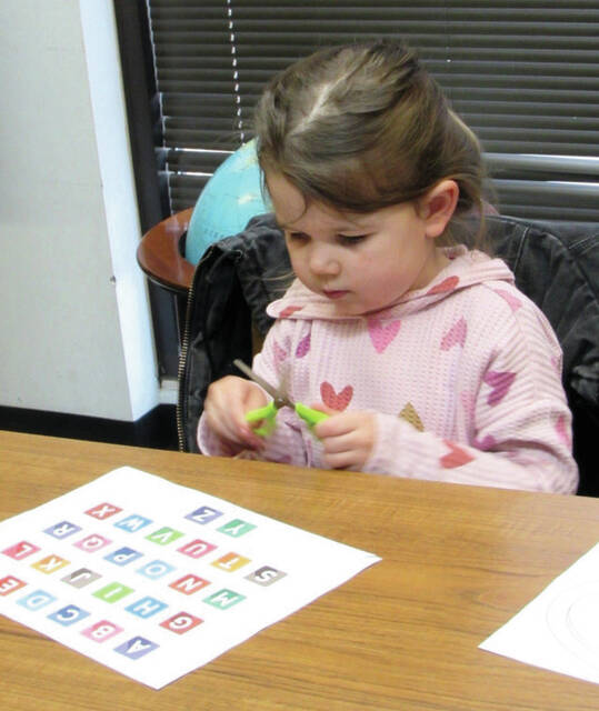At Storytime, preschoolers like Rosalee are given the opportunity to practice and improve their fine motor skills through activities such as writing and using scissors. If your children could benefit from enhancing these skills before kindergarten, bring them to Storytime. We take great pleasure in helping children learn and develop crucial early literacy skills essential for school.