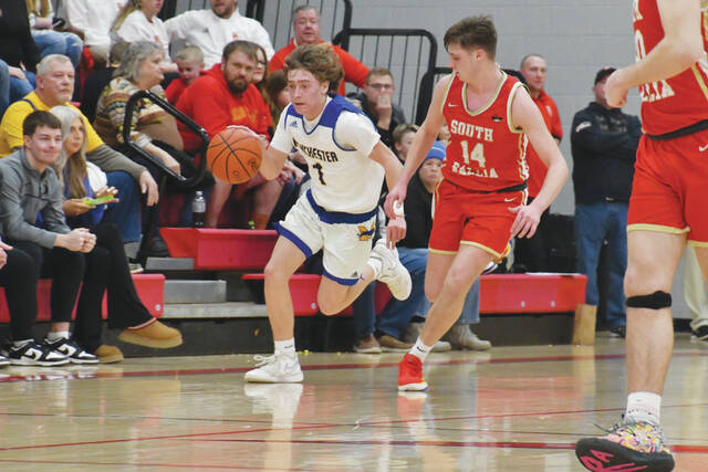 130408163_web1_Hayslip-SG
Manchesters Parker Hayslip pushed the ball up the floor at fast pace in action from the Greyhounds 59-41 sectional championship win over South Gallia on February 24. Hayslip scored 17 points as the Hounds improved to 15-9 on the season and advanced to the Division IV District Tournament. (Photo by Mark Carpenter)