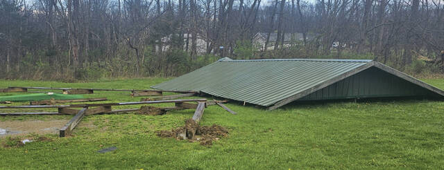 The roof of the Rec Park Shelter House lies next to the foundation after last weeks tornado damage. (Photo by Mark Carpenter)