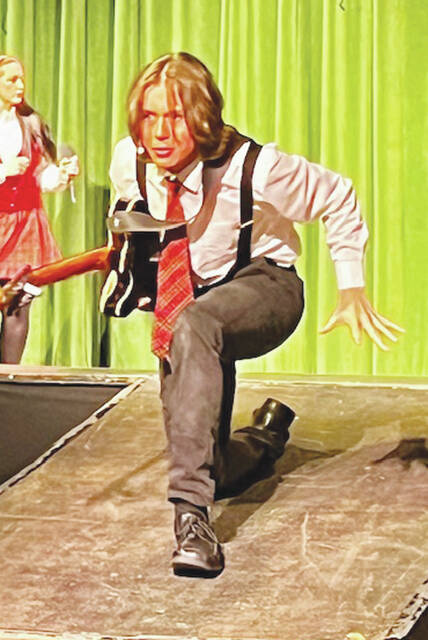 130570771_web1_Rock-1
Eighth grader Samson Strong plays the role of Zack Mooneyham. This is his second year involved with WUHS productions. (Photo by Sherry Larson)