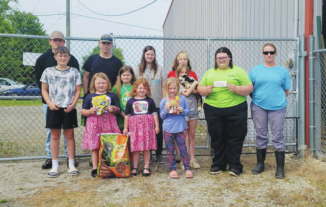 130658147_web1_LibertyFarmers
Front row, from left, Brenna Lyons-Fletcher, Shelby Fletcher, Briazia Nechting, Louella Fletcher and Dog Pound Assistant Cassie Creamer; Middle row, from left, Parker Young, Mnenetha Hoop, Samara Nechting with puppy Simon; Back row, from left, Jaxton Young, Yazael Nechting, Destiny Grooms and Sierra Centers.