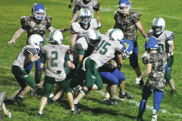 130893635_web1_MHSFB-1
On Friday, September 6, the Manchester Greyhounds battled the weather and the visiting Green Bobcats for a 28-21 victory that improved their record to 2-1 on the season. (Photo by Mark Carpenter)