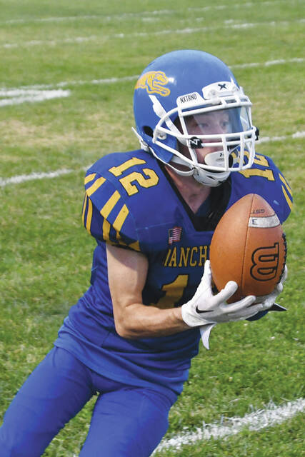130913074_web1_RonniwElam
Manchesters Ronnie Elam fields a punt early in action last Friday as the Greyhounds hosted the Sciotoville East Tartans. Elam and his explosive quickness and elusiveness has been one of the key reasons the Greyhounds have averaged over 28 points a game through four weeks. (Photo by Mark Carpenter)