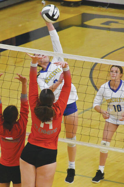 131002113_web1_MadisonDunn
Manchester senior Madison Dunn goes full extension for the southpaw kill attempt in the Lady Houndss district tournament win over New Boston. (Photo by Mark Carpenter)