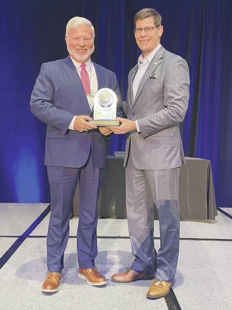 131107967_web1_Pell-BOY
Michael Pell, left,President and CEO of First State Bank, receives his Ohio Banker of the Year award from Michael Adelman, President and CEO of the Ohio Bankers League. (Photo provided)