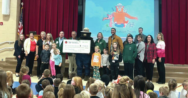 131109239_web1_PES-1
ODNR Department of Forestry and Smokey the Bear present a check for $173,041.09 to ACOVSD at Peebles Elementary School on Monday, Nov. 25. (Photo provided)