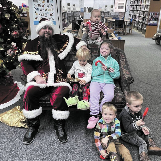 131153311_web1_Library-5
We had a magical Christmas Storytime at the Peebles Library! Chris Kringle made a special visit, spreading joy and holiday cheer. Kids enjoyed listening to festive stories, snapping pictures with Mr. Kringle, and indulging in delicious edible Christmas trees. (Photo provided)
