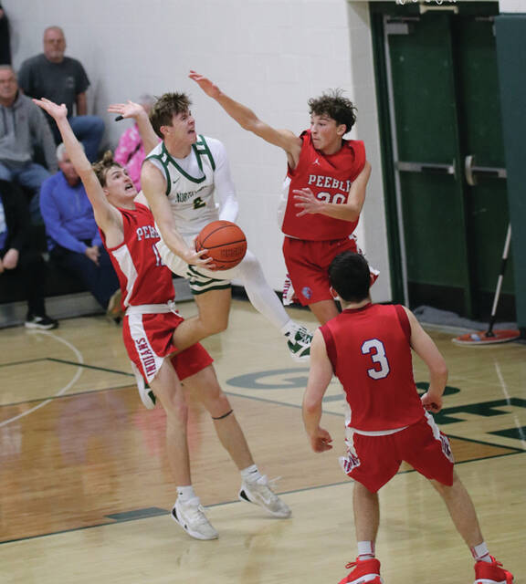 131168183_web1_Rothwell
This acrobatic shot in traffic by North Adams Jayce Rothwell came with 1:22 remaining in the game and gave the Devils a 55-50 lead over the Peebles Indians. The Devils held on for the 63-54 win to stay unbeaten in Southern Hills Athletic Conference play. (Photo by Patrice Yezzi England)