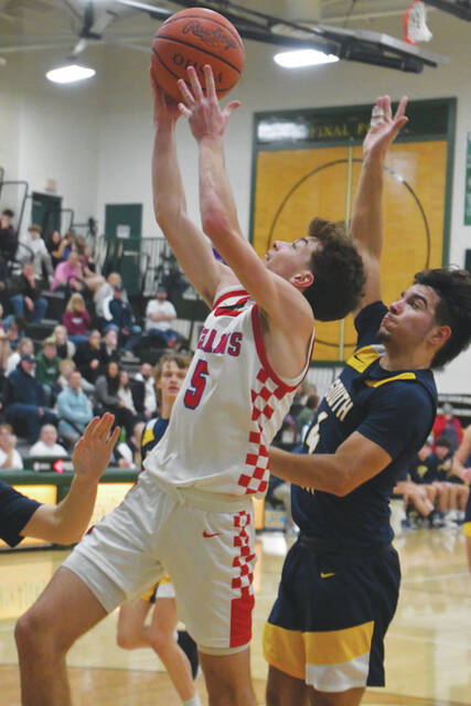 Peebles Colyn Sims drives hard to the bucket in the second half of the Indians battle with South Point in the January 18 Coach Young Classic. (Photo by Mark Carpenter)