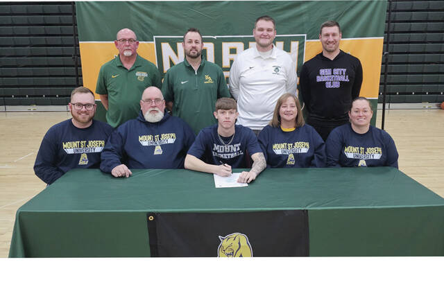 131361482_web1_RothwellSigning
Present for the March 4 signing ceremony at North Adams High School were: Front row, from left, Ethan Jones (brother), Robert Jones (father), Jayce Rothwell, Darlene Jones (mother) and Taylor Wilburn (sister); Back row, from left, Jeff Stricklett (NAHS Boys Basketball Assistant Coach), Ryan Unger (NAHS Boys Basketball Assistant Coach), Austin McCormick (NAHS Boys Head Coach) and Tony Peters (AAU Coach). (Photo by Mark Carpenter)