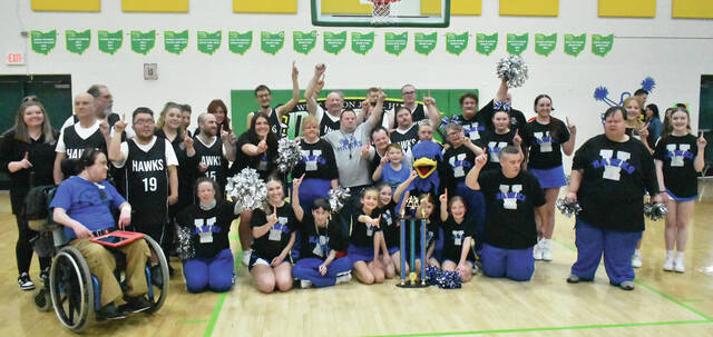 131370015_web1_Venture-Hawks-Win
Members of the Venture Hawks basketball team, cheerleaders, dance team, coaches, and support staff pose for a group picture after the Hawks beat the Eagles 60-54 on Sunday. (Photo by Ryan Applegate)