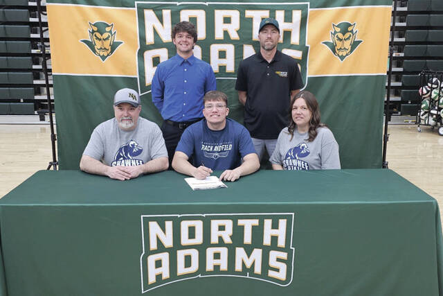 131436676_web1_DeAtleySigning
Present for the April 2 signing ceremony at NAHS were: Front row, from left, Richard DeAtley (father), Caleb DeAtley and Katie DeAtley (mother); Back row, from left, Connor Flynn (Shawnee State Mens Track Coach) and Jeff Raines (NAHS Boys Track Coach). (Photo by Mark Carpenter)