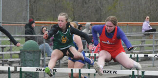 
			
				                                North Adams’ Morgan Wheeler, left, and Peebles’ Kiera Scott, right, compete in the Girls 100M Hurdles at the April 15 West Union Invitational. (Photo by Mark Carpenter)
 
			
		