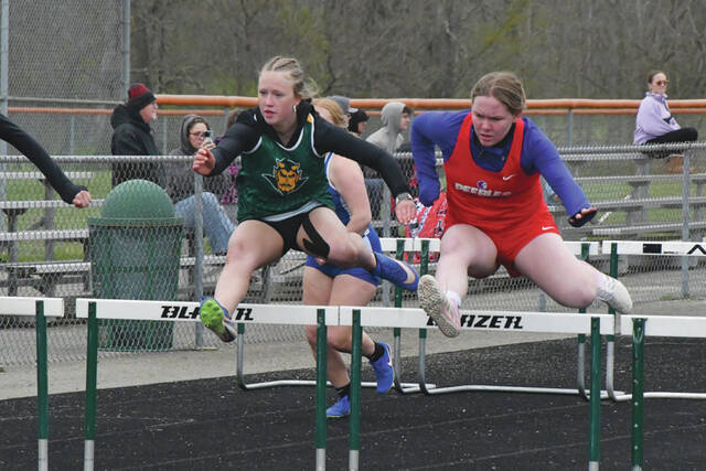 131447932_web1_Wheeler-Scott
North Adams Morgan Wheeler, left, and Peebles Kiera Scott, right, compete in the Girls 100M Hurdles at the April 15 West Union Invitational. (Photo by Mark Carpenter)