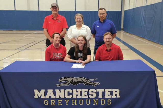 Present for the May 8 signing ceremony were: Front row, from left, Jennifer Dunn (mother), Madison Dunn and Chris Dunn (father, MHS Track Coach); Back row, from left, Matt Paxton (Rio Grande Womens Track Coach), Nicole Whitley (MHS Track Coach) and Aaron Lockhart (MHS Athletic Director). (Photo by Mark Carpenter)