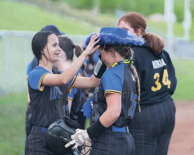 131504595_web1_Applegate-HR
After going deep in the bottom of the fourth inning, Manchesters Ellianna Applegate receives the home run hat from teammate Jaylise Applegate. The blast was part of a 17-4 Lady Hounds victory over Ripley on May 8. (Photo by Jordan Carpenter)