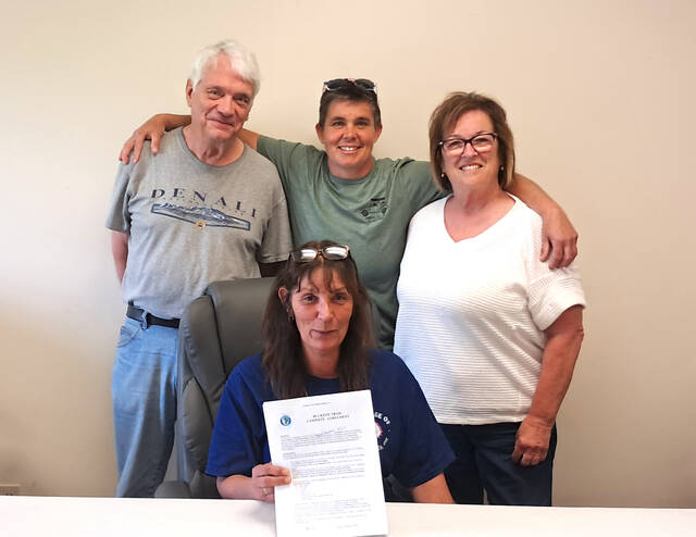 131523033_web1_Peebles-Trail-Town
Peebles Mayor Stephanie Harper signed and submitted the application for Peebles to be designated a Trail Town through the Buckeye Trail Association. Front, Hareper; Back, Steve Walker, Nikki Gerber and Debbie Ryan. (Photo by Ryan Applegate)