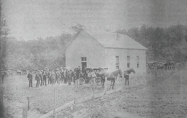 131652819_web1_Archives7-23
Pictured is an early view of the Lick Fork Church of the United Brethren in Christ. Taken by Lizzie Treber, this view shows a large gathering and was possibly taken at the dedication services held for the church building in 1900.