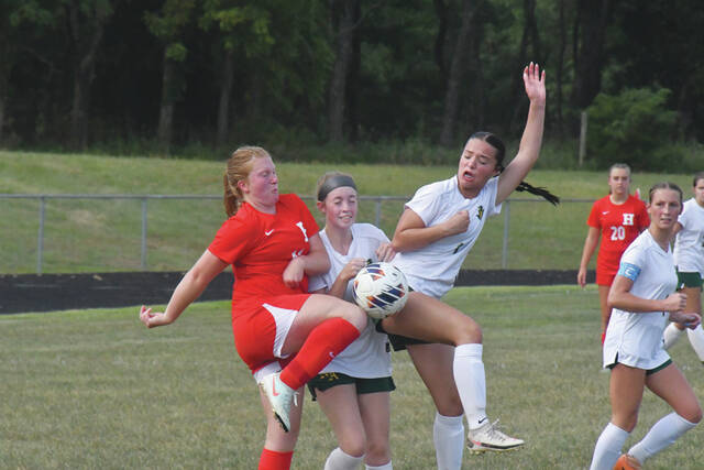 131721033_web1_Soccer-1
A crunch for possession included North Adams Lady Devils Ava Pemberton (center) and Paytton Shaver (right) in this action from an August 15 5-0 loss to Hillsboro. (Photo by Mark Carpenter)