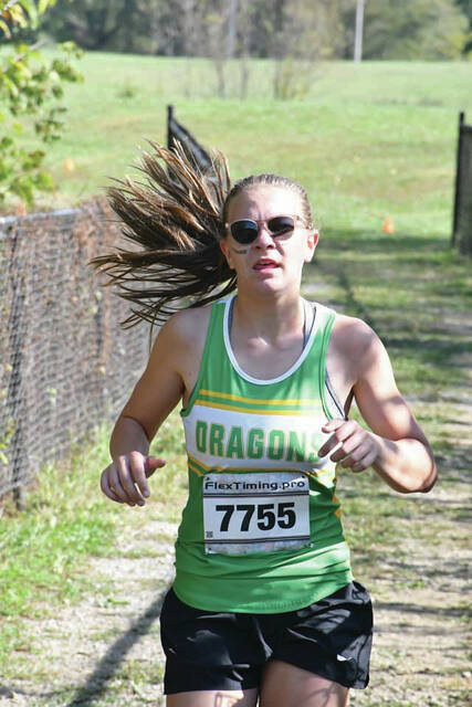 131827354_web1_Shupert
West Union sophomore Ella Shupert, with a time of 21:28.5, finished second overall in the high school girls race at last weekends West Union Invitational;. (Photo by Mark Carpenter)