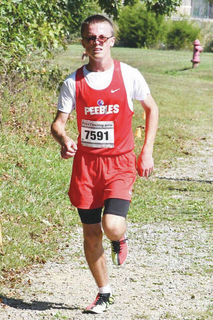 <p>Peebles sophomore Calen Vogler placed eighth overall in the high school boys race at the October 4 West Union Invitational. (Photo by Mark Carpenter)</p>