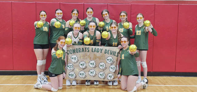 131844862_web1_NAHS-GoldBall
After their win at Eastern Brown last week, the North Adams Lady Devils celebrate their third consecutive gold ball trophy, again going 13-0 in conference play. (Photo by Mark Carpenter)