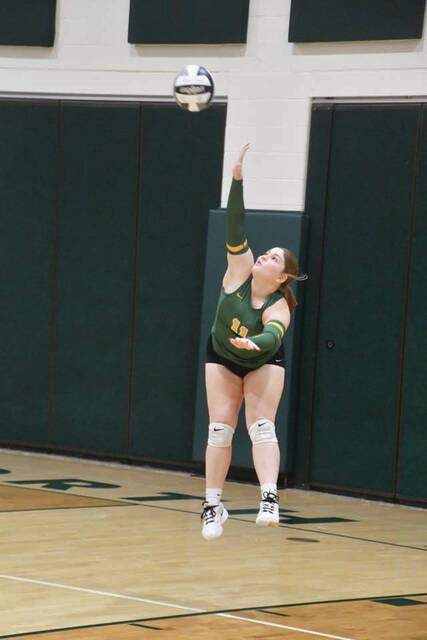<p>North Adams senior Addison Shupert gets airborne on this serve attempt as the Lady Devils downed Meigs in three sets to advance to the Division V district semifinals. (Photo by Mark Carpenter)</p>