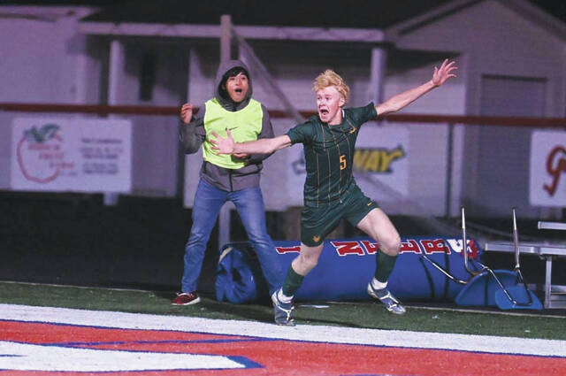 131879134_web1_Reckers
North Adams Jayden Reckers celebrates his overtime game-winning goal in the Devils 1-0 district semifinal win over Minford. (Photo by Tim Daulton)
