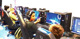 
			
				                                Manchester High School Afterschool Program participants gather in the schools new eSports lab, where students compete in national online tournaments. (Photo by Ryan Applegate)
 
			
		