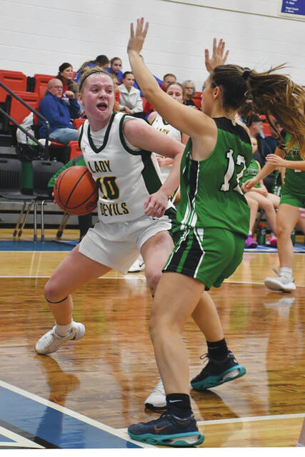 <p>North Adams freshman Tenzlee Burns (10) looks for room to get around a Fayetteville defender as last year’s SHAC champions battled in the annual SHAC Girls Preview. (Photo by Mark Carpenter) </p>