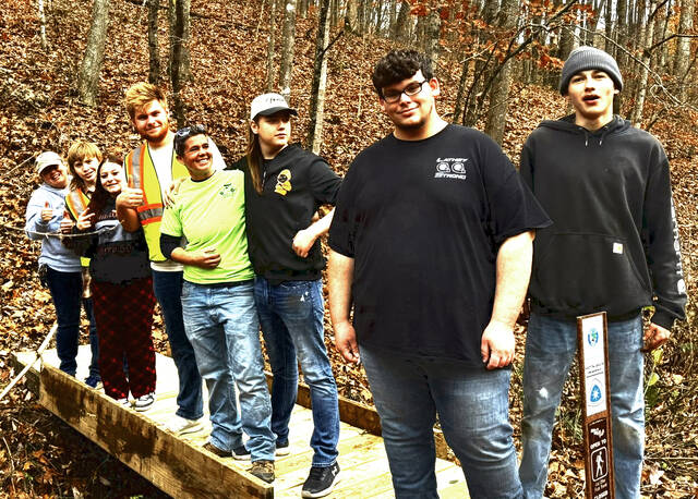 131955640_web1_New-Bridge-at-Blacks-Run
Volunteers, Buckeye Trail members, and juvenile probation participants join Nikki Gerber on the newly completed bridge at Blacks Run, built November 15 as part of a community effort to restore the Buckeye Trail and strengthen local connections. (Photo submitted by Nikki Gerber)