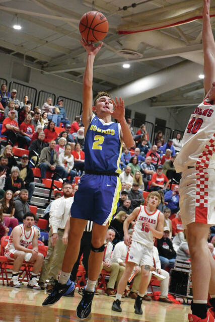 <p>Manchester’s Landen Doyle goes up for a shot attempt on the baseline in the Greyhounds’ loss at Peebles on December 5. (Photo by Mark Carpenter)</p>
