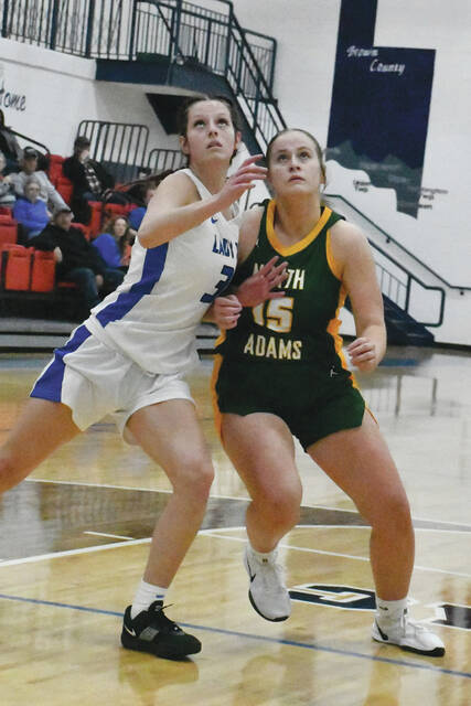 <p>Ripley’s Raquel Hackney, left, and North Adams’ Elizabeth Raines, right, battle for a rebound as the two teams battled last week in Southern Hills Athletic Conference action. (Photo by Mark Carpenter)</p>
