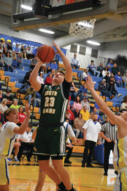 132015111_web1_CarsonDavis-MHS
North Adams sophomore Carson Davis put up a career-high 29 points as the Green Devils upended Manchester 59-54 in Southern Hills Athletic Conference action.(Photo by Mark Carpenter)