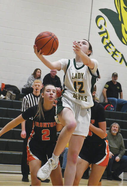 <p>North Adams’ Bella Gray (12) scores on a layup late in the fourth quarter of the Lady Devils’ 57-27 win over Ironton on January 9. (Photo by Mark Carpenter)</p>