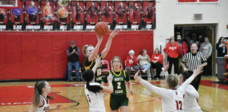 
			
				                                Giving it 110% to the very end, North Adams freshman Tenzlee Burns fires in along three-pointer in the final seconds as the Lady Devils fell 50-46 to Eastern brown on February 5. Burns tallied 26 points in the defeat. (Photo by Mark Carpenter)
 
			
		