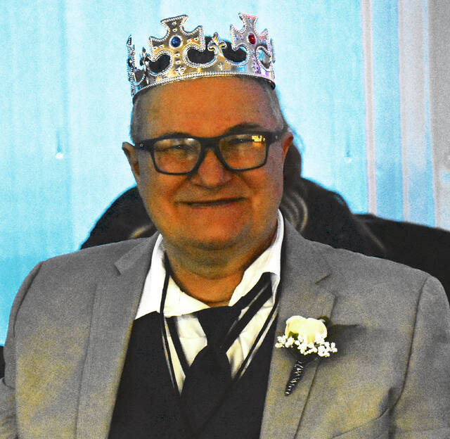 Wearing his crown after the ceremony, a Night to Shine guest embodies the spirit of the event, which recognizes each attendee as a king or queen during the communitys night of celebration. (Photo by Ryan Applegate)