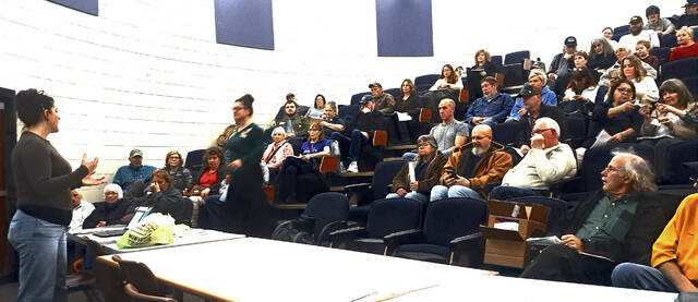 Residents gather in the round room at Manchester High School to discuss concerns, share research, and ask questions about possible data center development in Adams County during a community meeting set up by Emily and Laura Harper and Nikki Gerber. (Photo by Ryan Applegate)