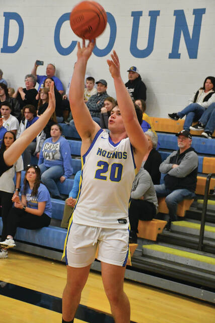 Manchester senior Luke Applegate did his damage from the inside and the outside in the Greyhounds 64-51 district quarterfinal win over Portsmouth Clay. Applegate led the victorious Hounds with 23 points. (Photos by Mark Carpenter)