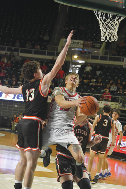 Peebles senior Grady Knechtly maneuvers around Easterns Boston Webb (13) in action for the Indians victory over Eastern Pike in a Division VI district championship game. (Photo by Mark Carpenter)