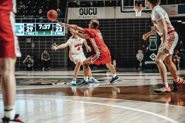 Peebles senior Grady Knechtly (10) spots an open teammate and delivers the pass in action from the Indians regional semifinal loss to Portsmouth West on March 12. (Photo by Mandy Lynn Photography)