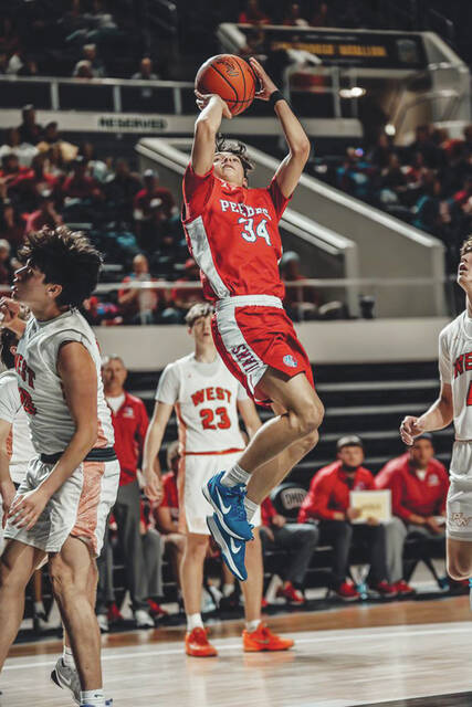 Junior Josh McClary (34) led the Peebles Indians in scoring with 15 points int heir season-ending regional tournament loss to Portsmouth West on March 12 at The Convo. (Photo by Mandy Lynn Photography)
