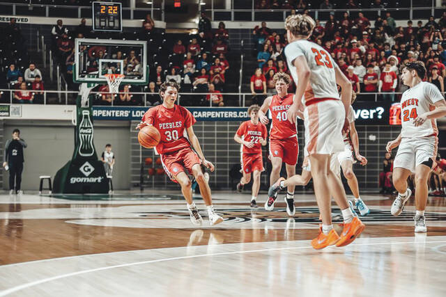 Peebles senior Paxton Ryan brings the ball into the front court in his final game for the Tribe, a 42-32 loss to Portsmouth West in the Division VI Sweet 16. (Photo by Mandy Lynn Photography)