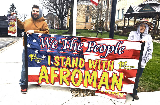 Supporters gather in front of the Adams County Courthouse on Monday, March 16, 2026, holding signs in support of Afroman as his legal dispute with Adams County Sheriffs Office deputies continues over the use of 2022 raid footage in the Lemon Poundcake music video. (Photo by Ryan Applegate)