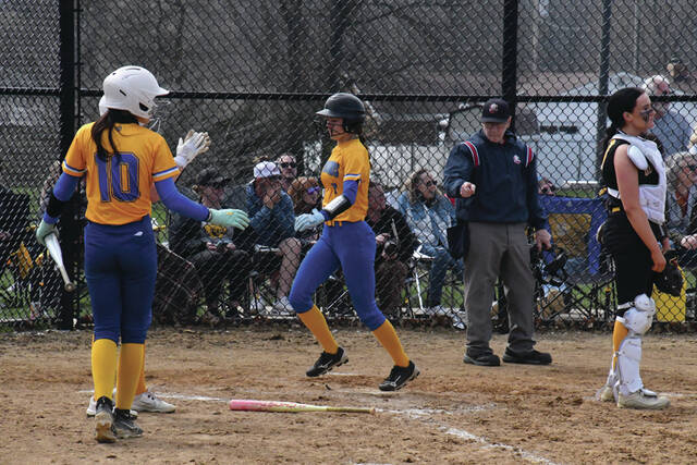 Manchesters Hayden King crossed the plate in the top of the sixth inning with what was at the time the go-ahead run as the Lady Hounds fell in extra innings, 7-6 to the Georgetown Lady G-Men. (Photo by Mark Carpenter)